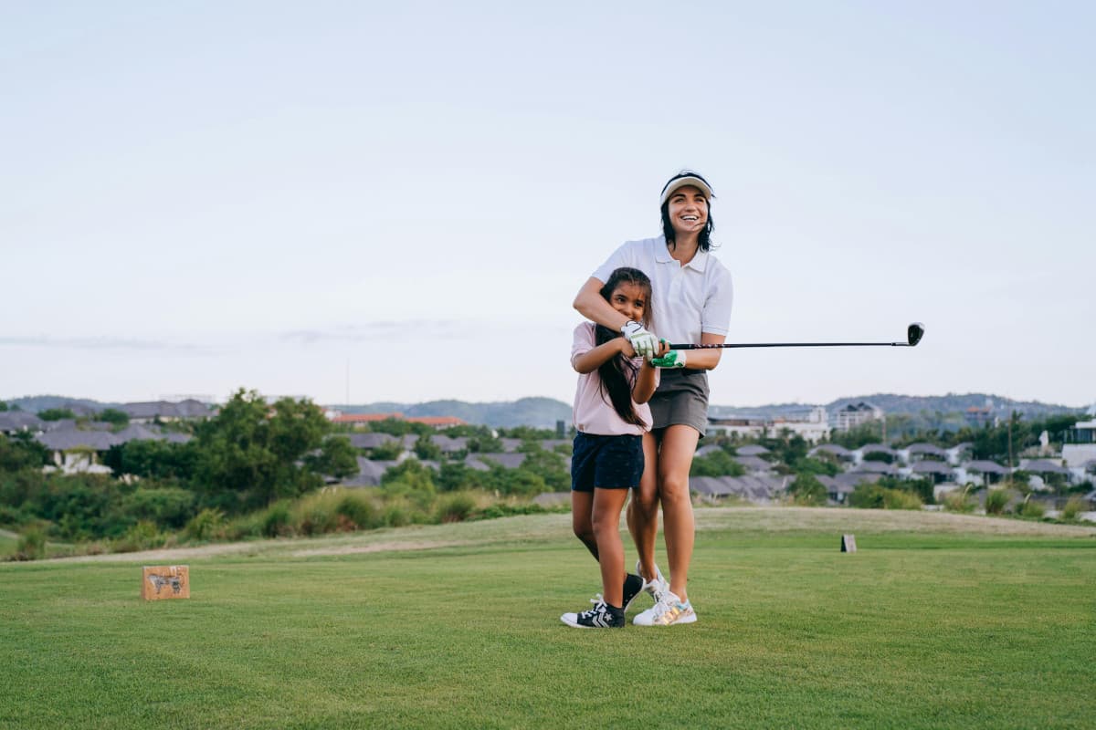 Golf coach with student